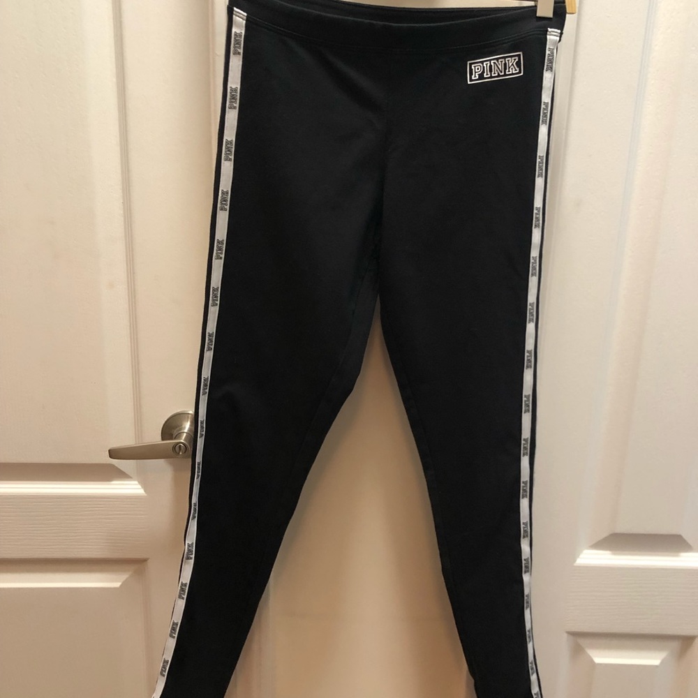 Pink leggings size XS black with white stripes on side